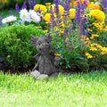 Baby dragon reading a book sculpture with butterfly figurines, outdoor garden art statue for kids' outdoor play and decor.