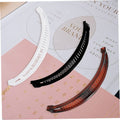 Three banana-shaped hair clips with fishtail design, suitable for girls and kids, featuring fun fish-shaped ponytail grips.