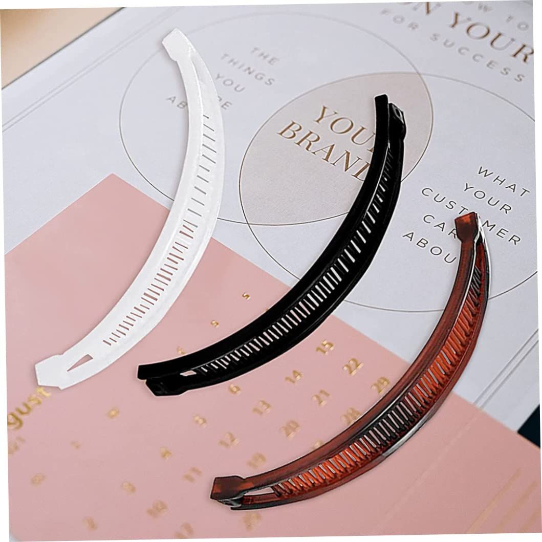Three banana-shaped hair clips with fishtail design, suitable for girls and kids, featuring fun fish-shaped ponytail grips.