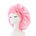 Pink satin silk sleep bonnet for women and girls, adjustable night bonnet for protecting hair during sleep, by Everything Baby.