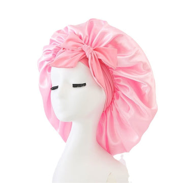 Pink satin silk sleep bonnet for women and girls, adjustable night bonnet for protecting hair during sleep, by Everything Baby.