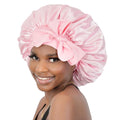 Pink satin sleep bonnet for women and girls, adjustable silk hair bonnet, part of girls' sleepwear by Everything Baby.
