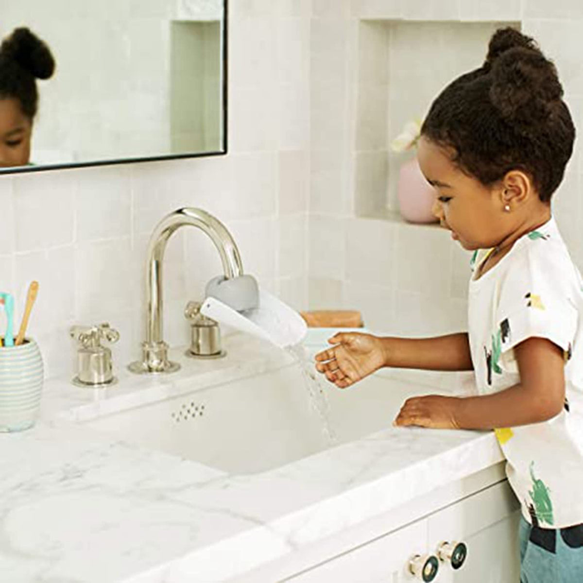 Grey faucet extender for babies and kids, portable water nozzle extension for sink hand-washing, by Everything Baby.