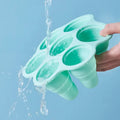 Colorful collapsible popsicle molds with seven cavities for making DIY ice pops, BPA-free ice lolly maker for kids and adults.