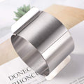 Adjustable stainless steel cake mold ring with sliding mechanism, ideal for DIY baking and mousse cakes, by Everything Baby.