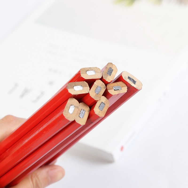 Set of 12 black lead carpenter pencils with flat octagonal shape, ideal for woodworking marking and construction projects.