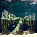 Resin aquarium decoration with simulated rock mountain, cave, and hiding spots for fish tank habitat, by Everything Baby.