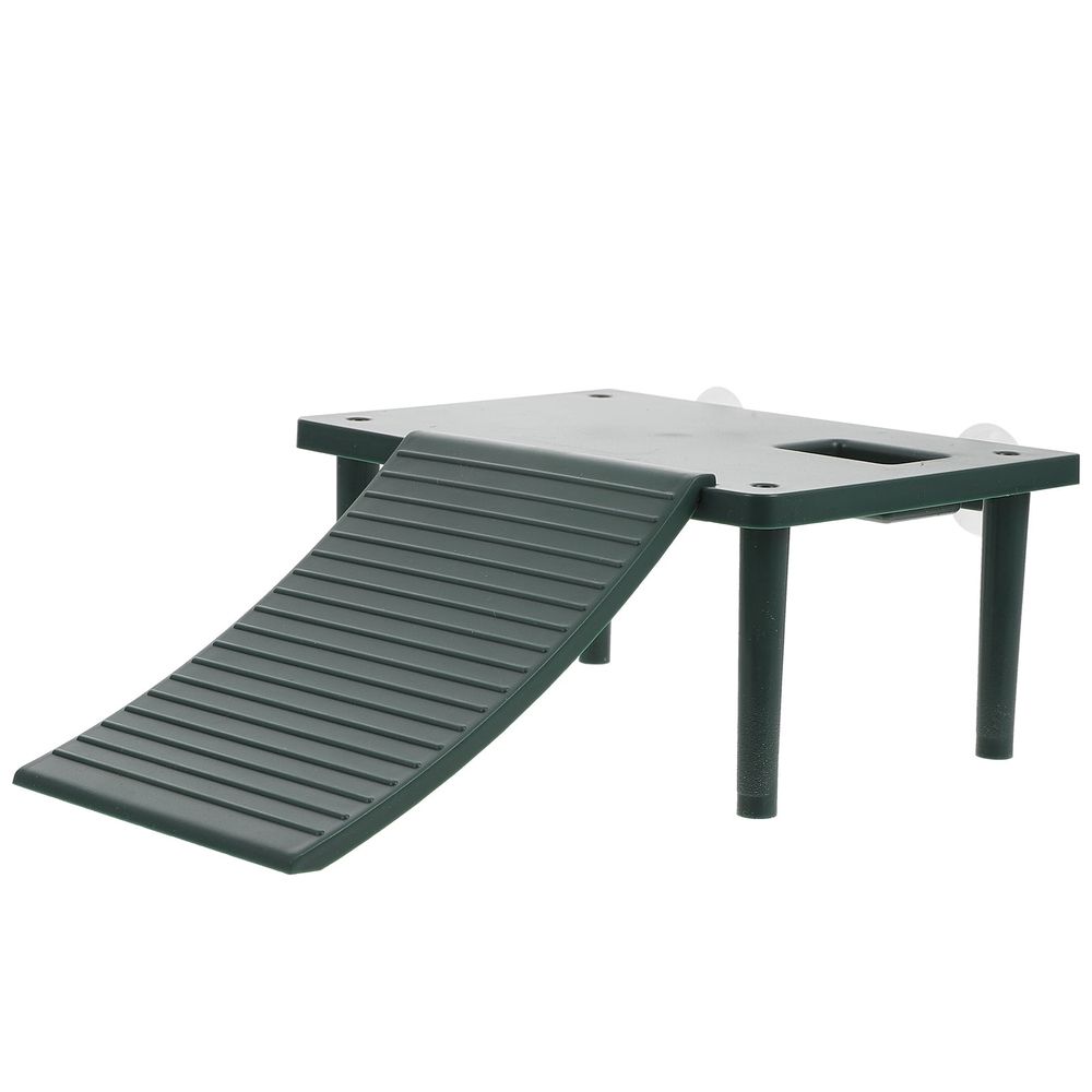 Green plastic turtle basking table enrichment toy for turtles, suitable for outdoor play and enrichment.