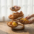 Small woven fruit basket stand by Everything Baby, rustic imitation rattan vegetable storage for farmhouse salad buffet display.