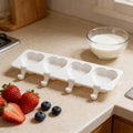 White silicone ice cream molds for DIY frozen desserts, ideal for kids' pretend play and creative kitchen fun.