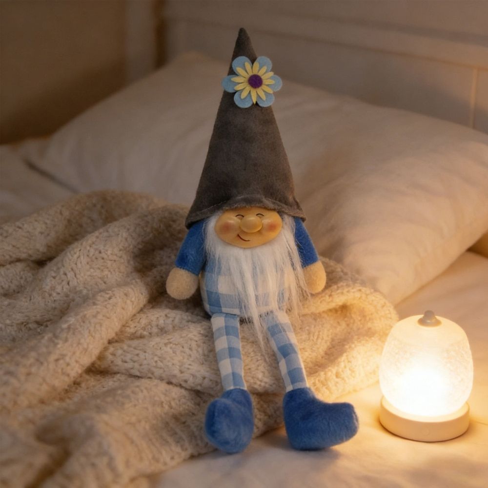 Cute dangling leg gnome doll by Everything Baby, smiling dwarf figurine for home decor on table or shelf, pink color.