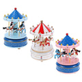 Red carousel music box by Everything Baby with mechanical movement, designed for kids' musical toys, featuring a charming carousel scene