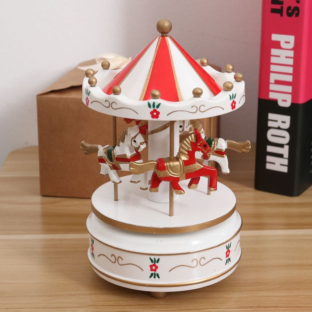 Red carousel music box from Everything Baby, featuring mechanical movement, designed as a musical toy for kids.