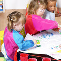 Six waterproof kids' art smocks with long sleeves and three pockets, ideal for toddlers aged 2-7 years, from Everything Baby.