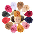 Baby girl hats with big flower bow, soft beanies and headwraps from Everything Baby, perfect for infants and toddlers.