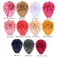 Baby girl hat with a large flower bow, soft beanie style, from Everything Baby, perfect for infants and toddlers.