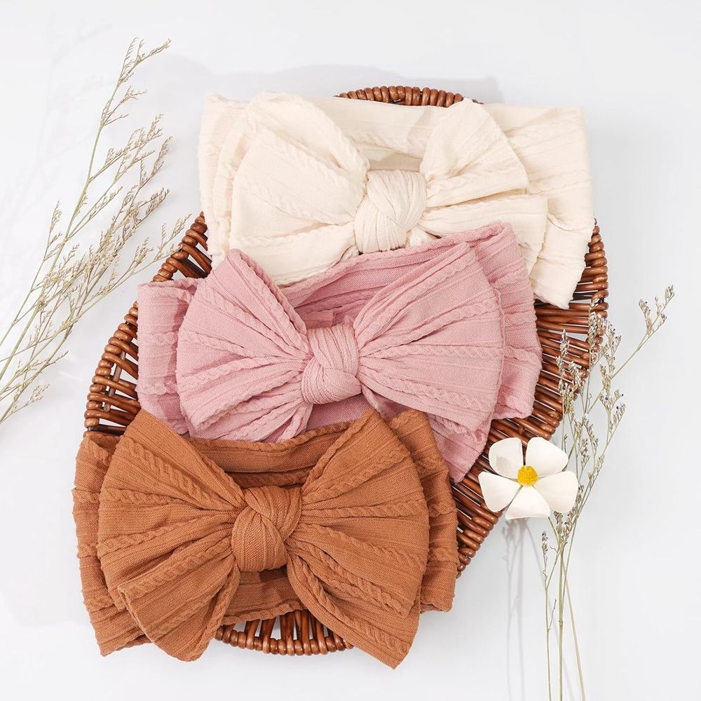 Six handmade baby headbands with double bows, nylon hair accessories for newborns, infants, toddlers, and kids by Everything Baby.