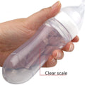 Silicone squeeze bottle and dispensing spoon for baby feeding, with 90ml capacity, from Everything Baby for toddler cereal and rice supplements.