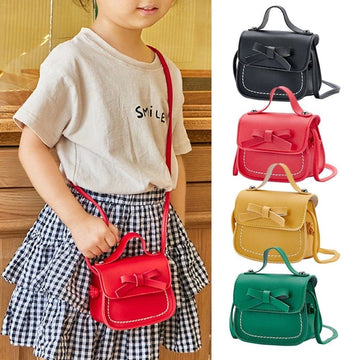 Cute kids' bow-shaped shoulder bag from Everything Baby, featuring a mini design with adorable details for girls and children.