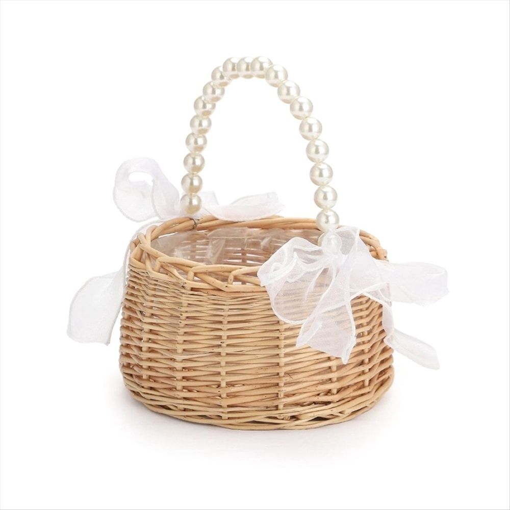 Handmade rattan wedding basket with handle and ribbon, designed for outdoor play or decoration, by Everything Baby.