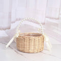 Handmade rattan wedding basket with handle and ribbon, designed for outdoor play and decorative use by children.