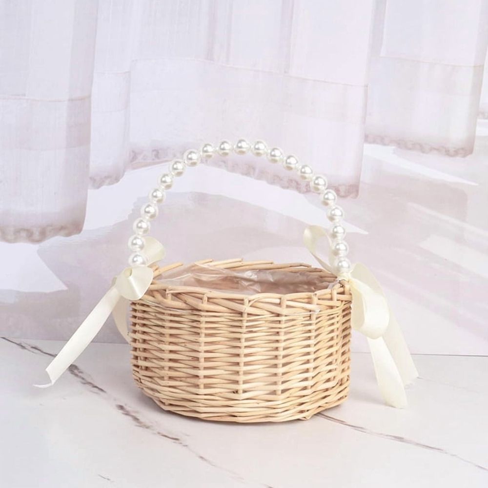 Handmade rattan wedding basket with handle and ribbon, designed for outdoor play and decorative use by children.