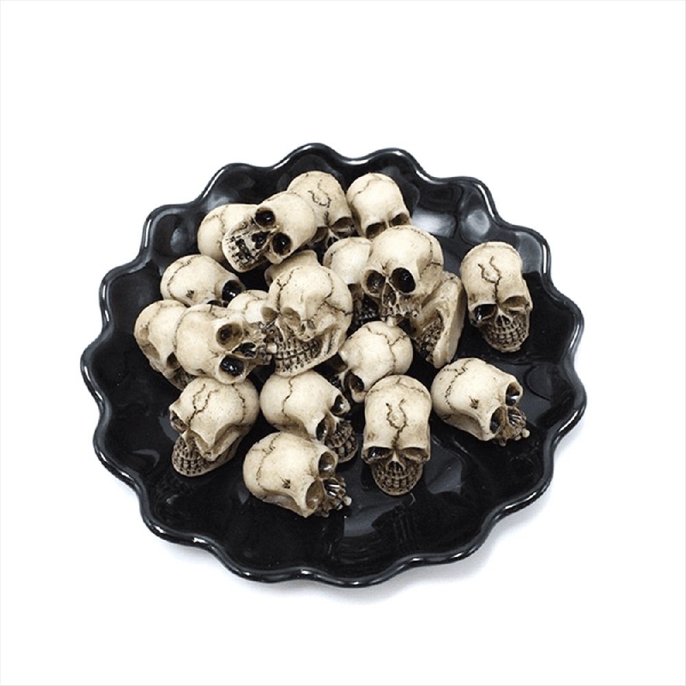 Set of 40 realistic human skull skeletons for Halloween table decor, ideal for spooky outdoor baby and kids' play setups.