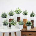 Artificial green leaf plant in modern white planter, indoor faux plant for home or office decor, by Everything Baby.