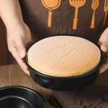 Round 8-inch nonstick cake mould and baking pans set, ideal for baking and pretend play in a baby and kid's toy kitchen.