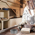 Black graphite mold for metal smelting, round ingot mold, high performance, suitable for outdoor metalworking projects.
