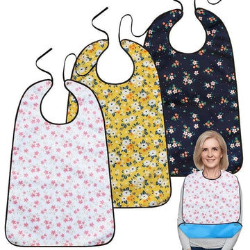 Three reusable adult bibs for elderly women and men, with crumb catchers, used as clothing protectors during feeding.