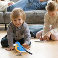 Realistic singing chirping bird toy by Everything Baby, interactive bird with motion, suitable for kids' pretend play, battery operated.