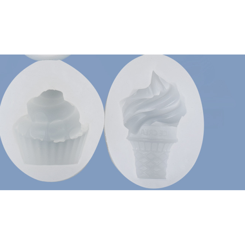 Four silicone ice cream cone molds with strawberry, raspberry, cherry, and chocolate designs for cake and dessert decorations.