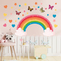 Colorful rainbow wall sticker featuring butterflies, rabbits, elephants, and clouds for children's bedroom or playroom decor.