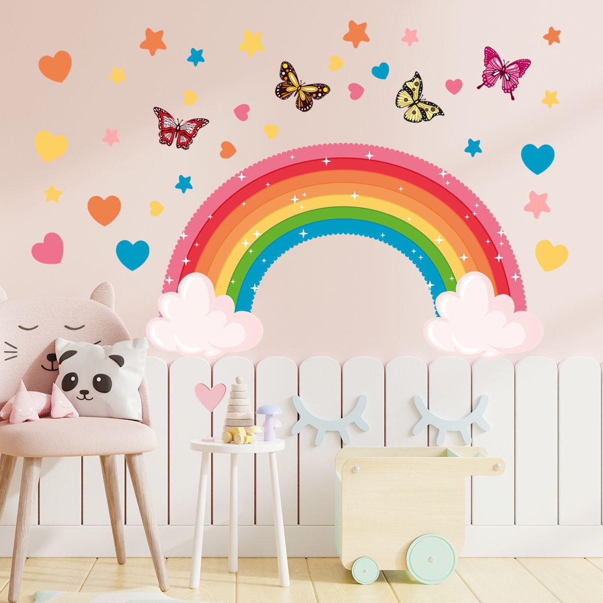 Colorful rainbow wall sticker featuring butterflies, rabbits, elephants, and clouds for children's bedroom or playroom decor.