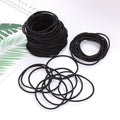 Set of 100 black mini seamless hair ties for girls and toddlers, soft elastics for ponytails, by Everything Baby.