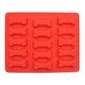 Silicone molds with mini pet treat bones for dogs and cats, ideal for homemade baked treats and chocolate candies.