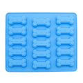 Two silicone pet treat molds shaped like small bones for homemade dog and cat treats, perfect for baking chocolates or candies.
