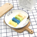Two silicone molds shaped like pet treat bones from Everything Baby, used for homemade dog and cat treats and chocolates.