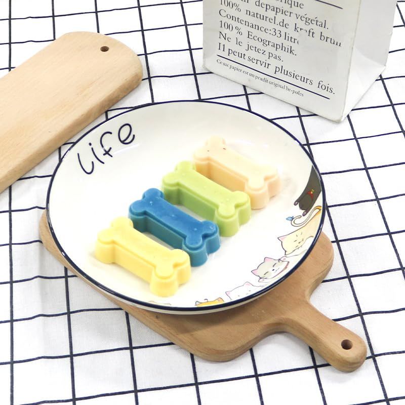 Two silicone molds shaped like pet treat bones from Everything Baby, used for homemade dog and cat treats and chocolates.