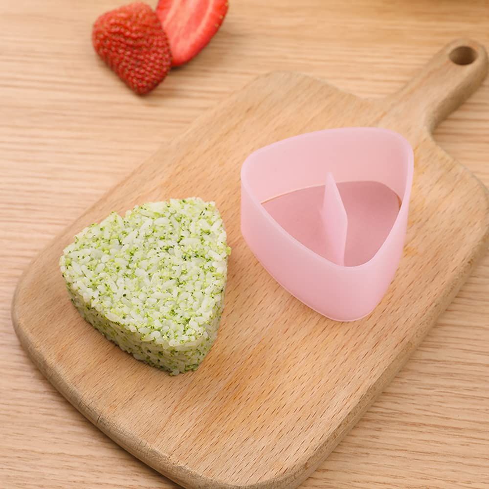 Non-stick triangle sushi press mold for making rice balls, Japanese bento gadget, by Everything Baby, shown with rice inside.