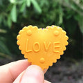 Six box-packed cute Kawai milk cookie erasers for kids, colorful and creative school stationery, ideal for children and students.
