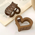 Set of four matte acrylic heart hair claw clips for women, non-slip design, perfect for Valentine's Day accessories.