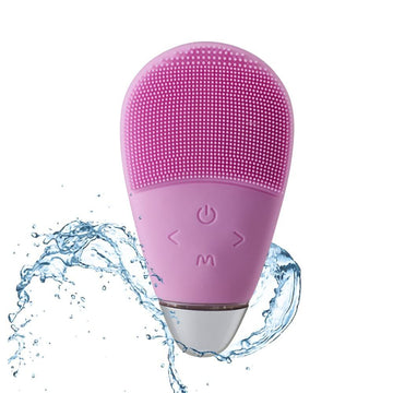 Pink facial cleansing massager brush from Everything Baby with soft silicone bristles, waterproof rechargeable face massager for gentle skin care.