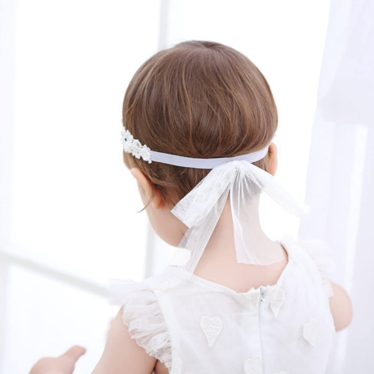 Soft stretchy baby hair band with floral design, suitable for newborns, infants, and toddlers, from Everything Baby.