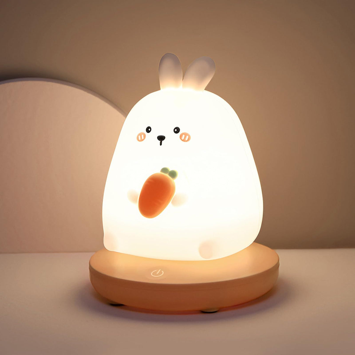 Cute carrot-shaped rabbit LED night light for kids, made of silicone, adjustable and perfect for children's rooms.