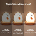 Cute silicone carrot rabbit LED night light for children’s room, adjustable, soft glow, perfect for bedtime comfort.