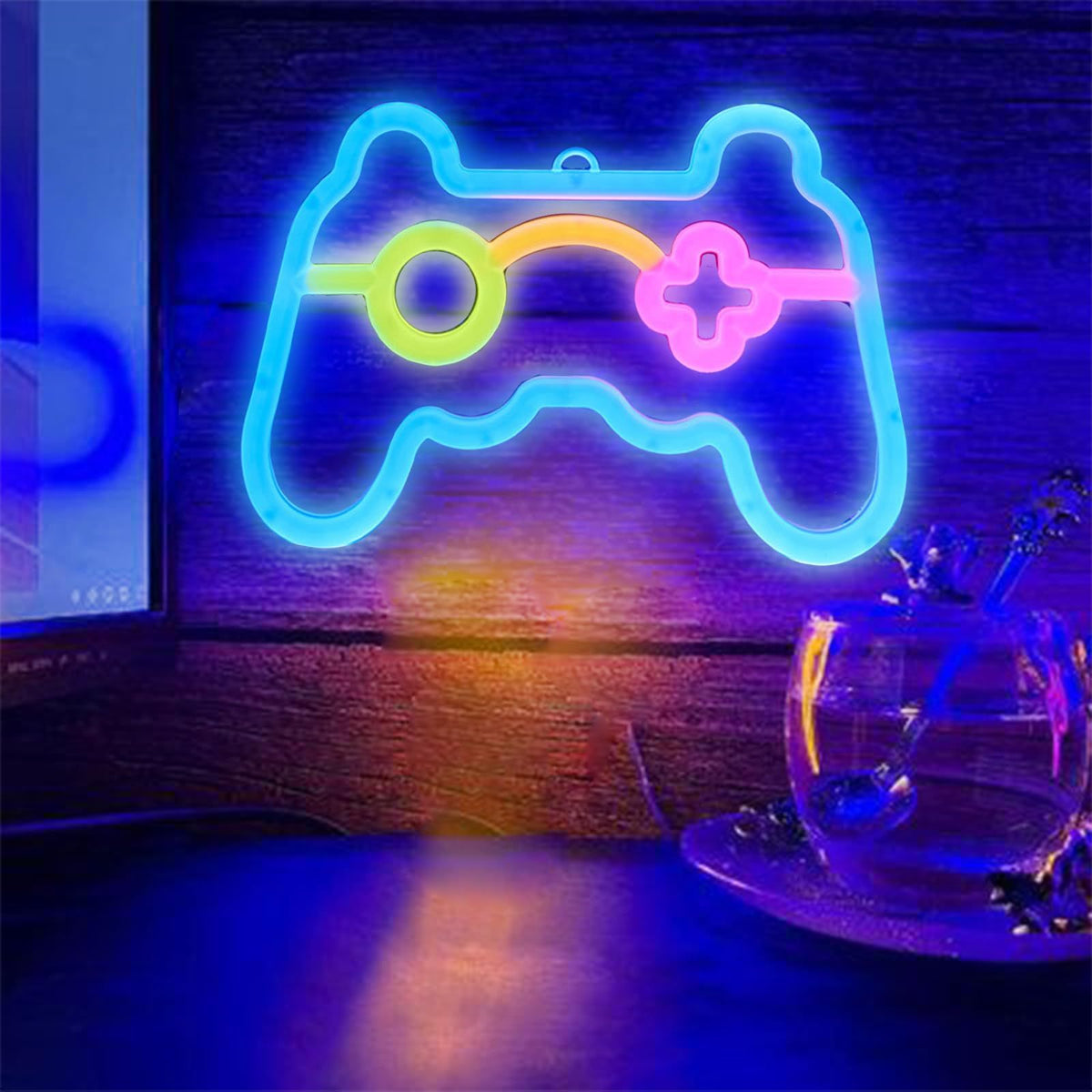 Colorful neon sign shaped like a game controller, ideal for gamer rooms and teen gaming decor, bright LED lights for wall display.