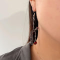 Spooky skull skeleton dangle earrings with bloody knife design for women, Halloween jewelry featuring scary, horror-themed details.