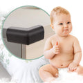 Black 4-piece corner protector set for baby proofing furniture and fireplace edges, made by Everything Baby for child safety.